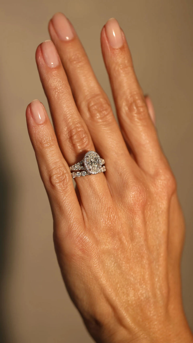 Oval cut diamond engagement ring on woman's hand