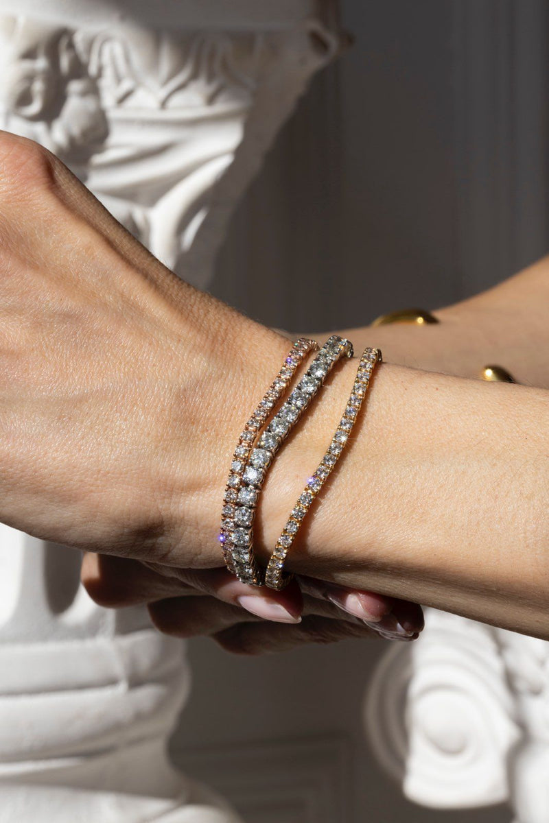 A woman wearing three Tennis Bracelets wants to learn more about the origin of the term 