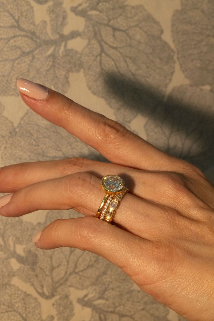 A woman wears stacked Diamond Rings, ideal for everyday wear.