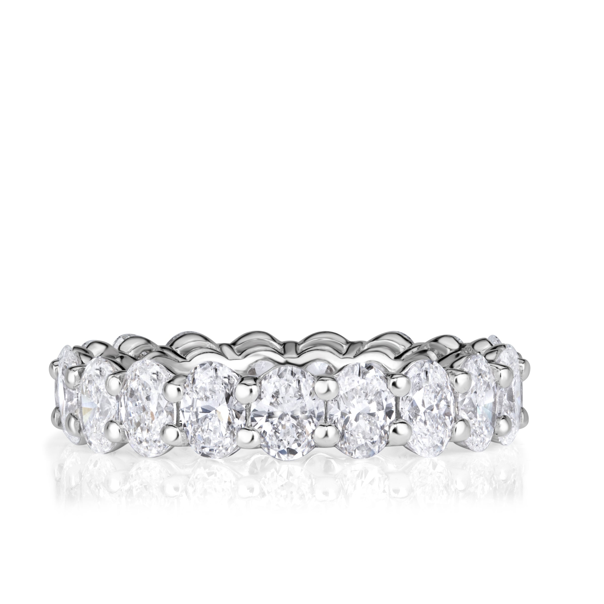 18k white gold shared prong setting with oval diamonds set in an eternity band. 