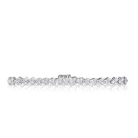 18k White Gold round brilliant cut diamond bracelet with staggering diamonds clustered in sets of three. 