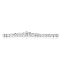 Oval cut diamond tennis bracelet in 18k white gold set with 4 prongs. 