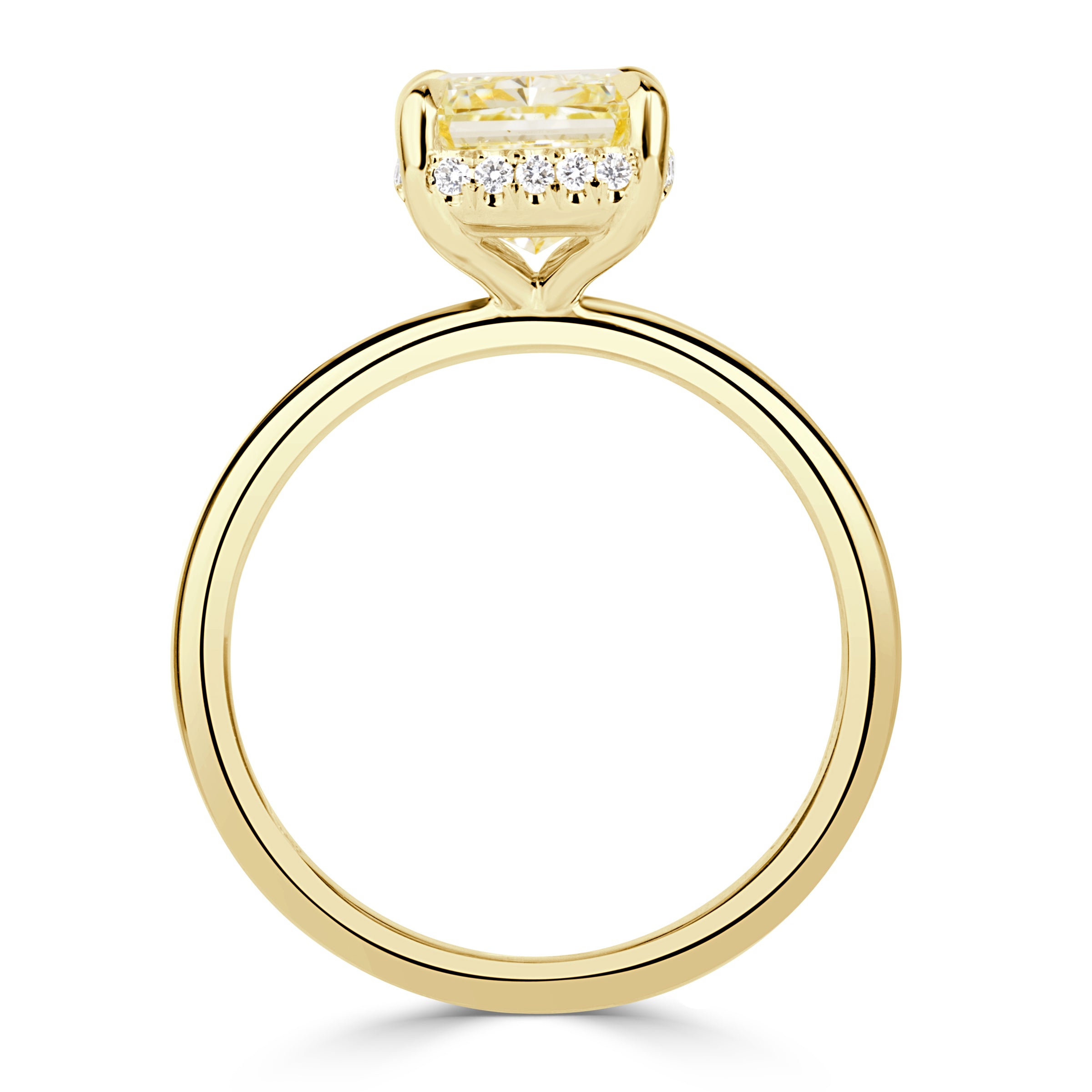 Elongated cushion cut canary yellow diamond with a hidden halo and yellow gold band. 
