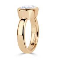 Side view of Oval lab diamond ring, bezel set horizontally with 4mm polished band. 