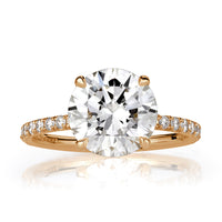 Round cut lab grown diamond with pave diamond band and hidden halo of diamonds in 18k yellow gold. 